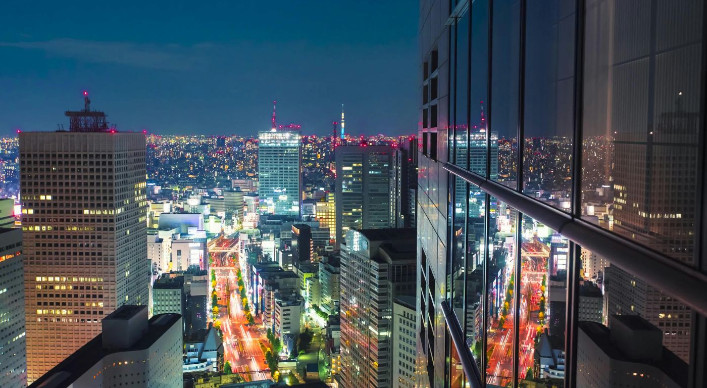 Vista aérea de Tóquio iluminada à noite — orçamento e custos reais para brasileiros viajarem ao Japão